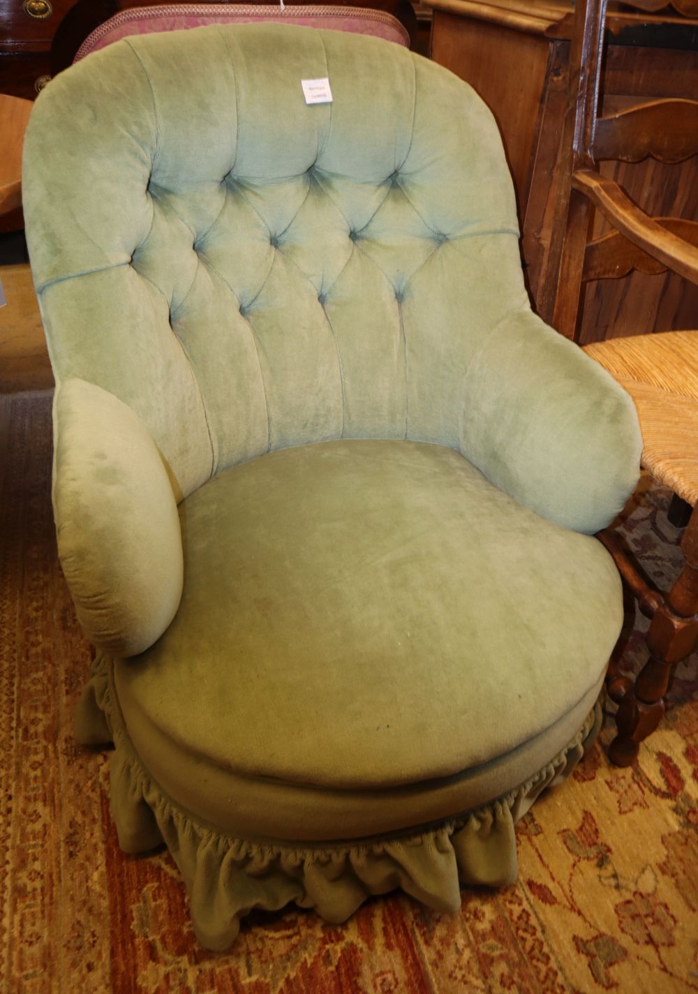 A late Victorian tub armchair